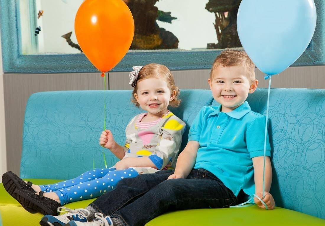 two happy patient, each holding a balloon | O'Fallon | Des Peres | Ladue | Chesterfield
